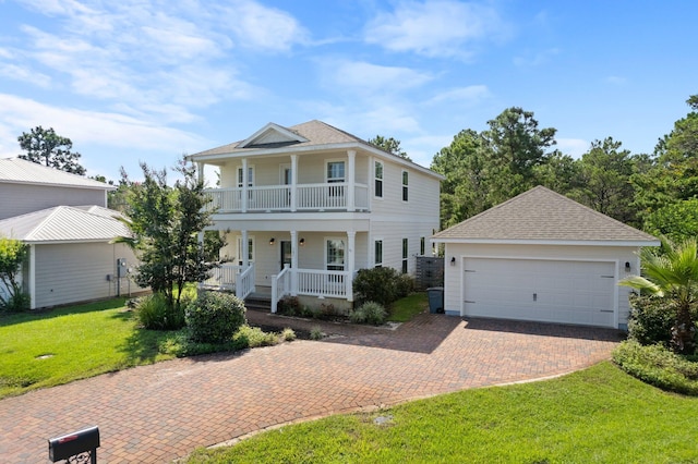 view of front of house with a garage, a balcony, covered porch, and a front lawn