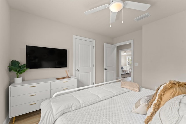 bedroom featuring light hardwood / wood-style flooring and ceiling fan