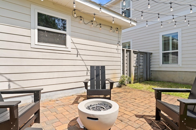 view of terrace with a fire pit