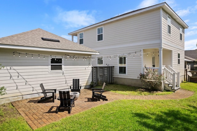 back of house with a yard and a patio area