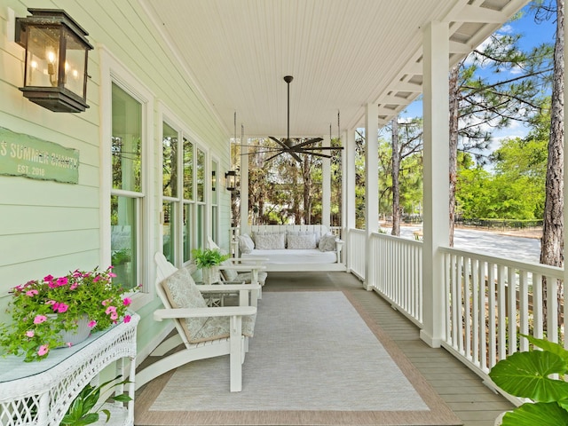 sunroom with wooden walls and wood finished floors