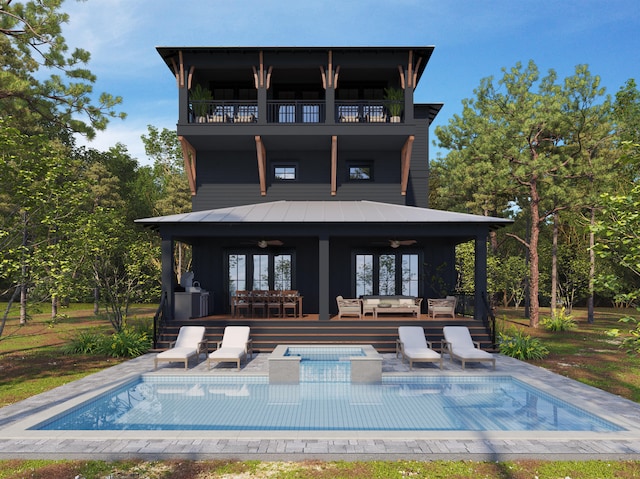 back of house with a patio area, a balcony, and an outdoor hangout area