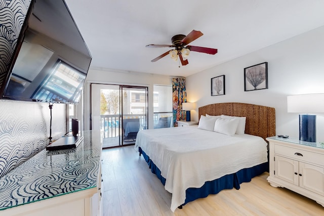 bedroom with light hardwood / wood-style floors, ceiling fan, and access to outside