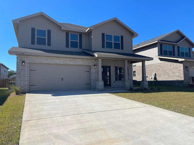 view of front of house with a front yard and a garage