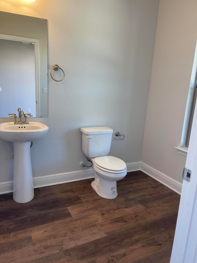 bathroom featuring toilet and hardwood / wood-style floors