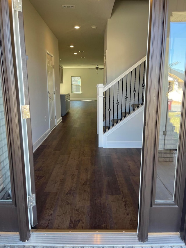 corridor with dark wood-type flooring