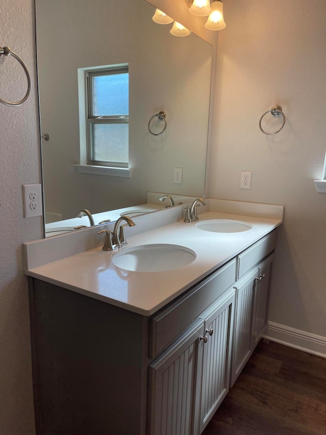 bathroom with vanity and hardwood / wood-style flooring