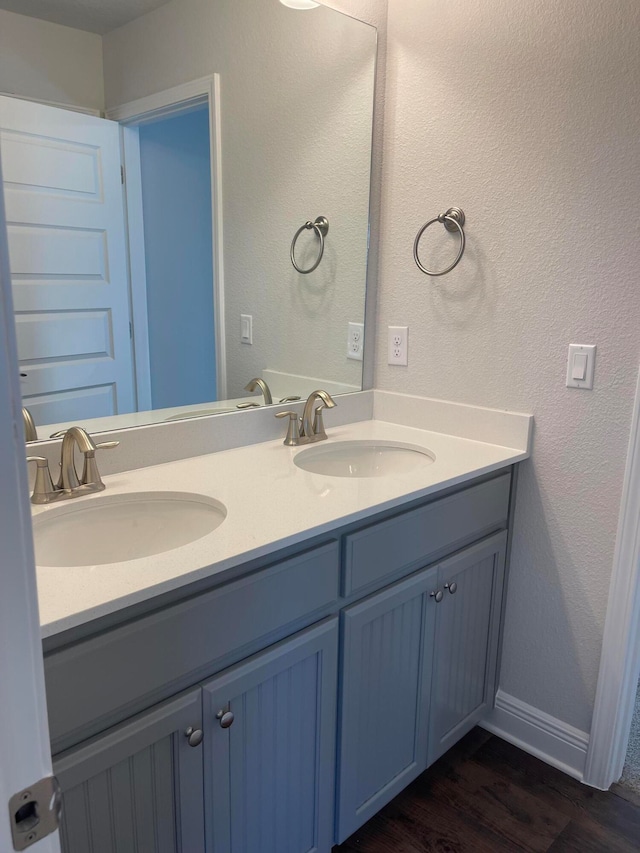 bathroom featuring vanity and hardwood / wood-style flooring