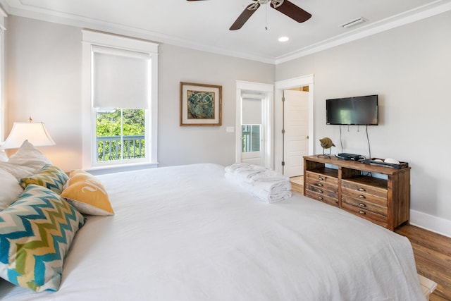 bedroom with wood-type flooring, ceiling fan, and crown molding