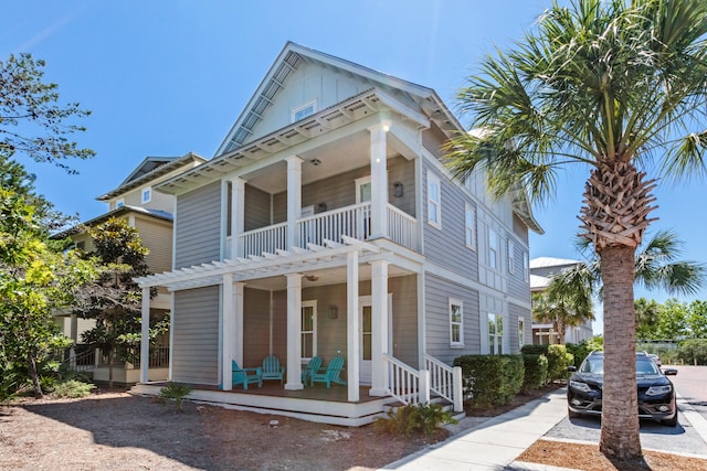 view of front of property with a balcony and covered porch