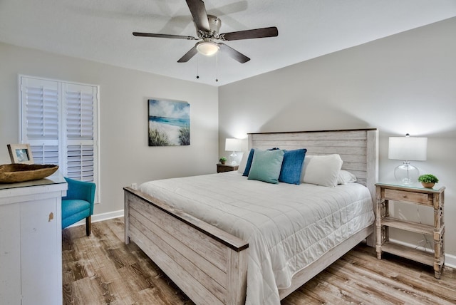 bedroom featuring hardwood / wood-style floors and ceiling fan