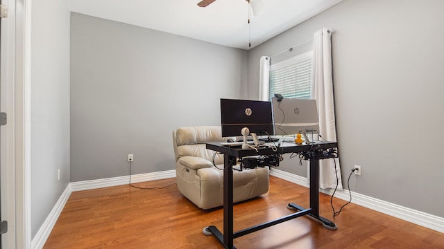 office with ceiling fan and hardwood / wood-style flooring