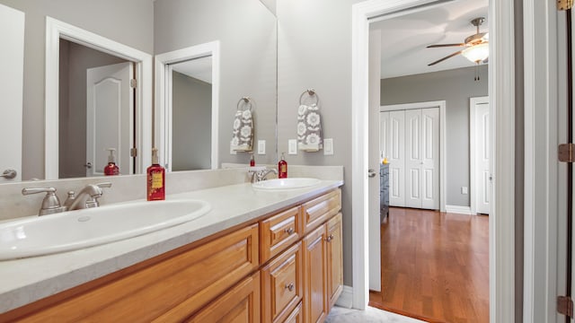 bathroom featuring vanity, hardwood / wood-style flooring, and ceiling fan