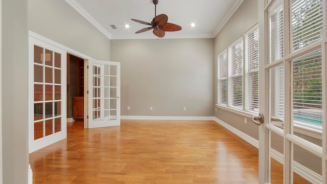 spare room featuring ceiling fan, french doors, light hardwood / wood-style floors, and ornamental molding