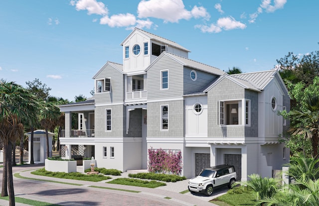 view of front of home with metal roof, a standing seam roof, and stucco siding