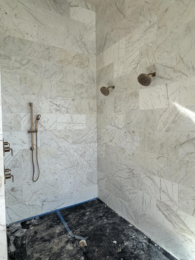 full bath featuring tiled shower