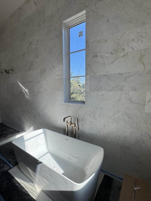 bathroom featuring a freestanding bath