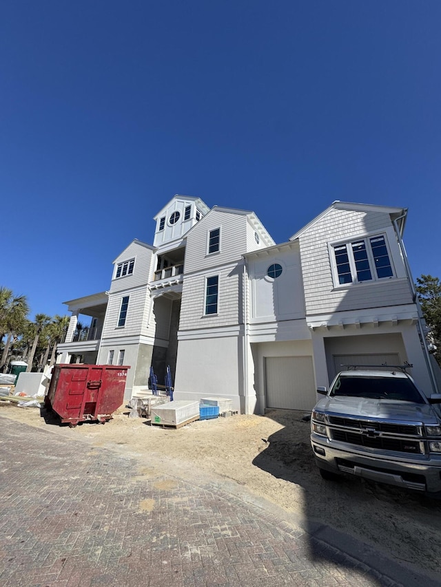 view of front of property featuring a garage and stucco siding