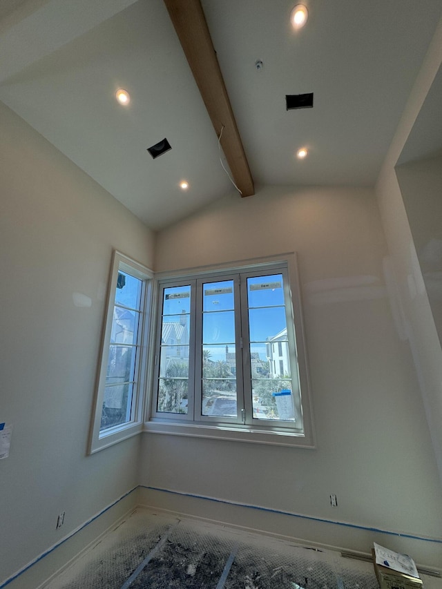 interior space featuring recessed lighting and lofted ceiling with beams