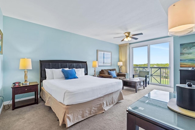 carpeted bedroom with access to outside and ceiling fan