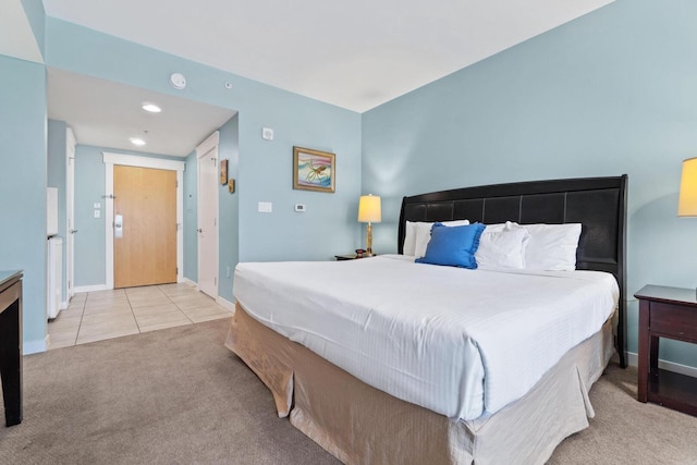 bedroom featuring light colored carpet