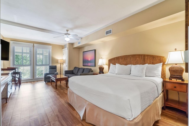 bedroom featuring hardwood / wood-style flooring and ceiling fan