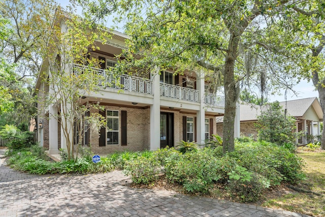 view of front of house with a balcony