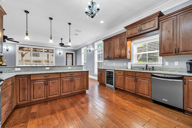 kitchen with ceiling fan with notable chandelier, wine cooler, dishwasher, and hanging light fixtures