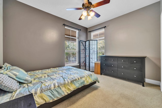 bedroom with ceiling fan and carpet floors