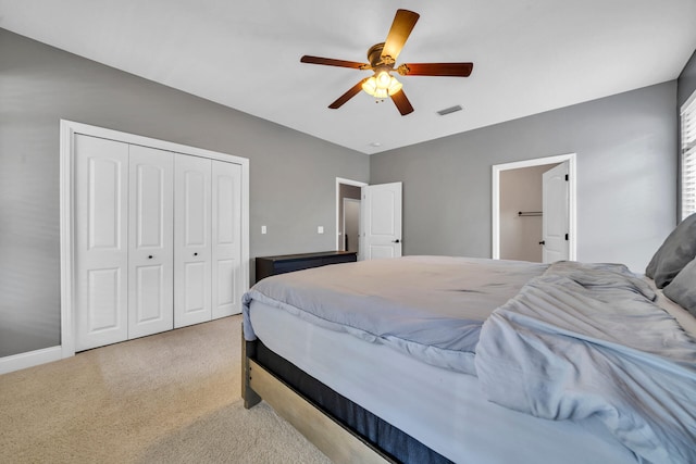 bedroom featuring carpet, ceiling fan, and a closet