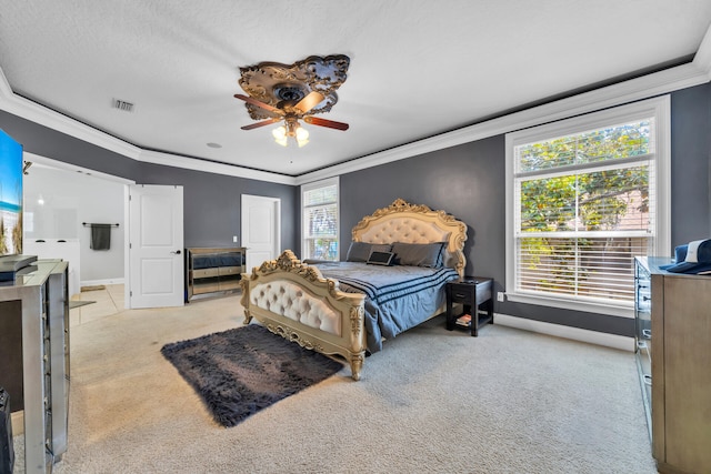 bedroom with ceiling fan, light carpet, and crown molding