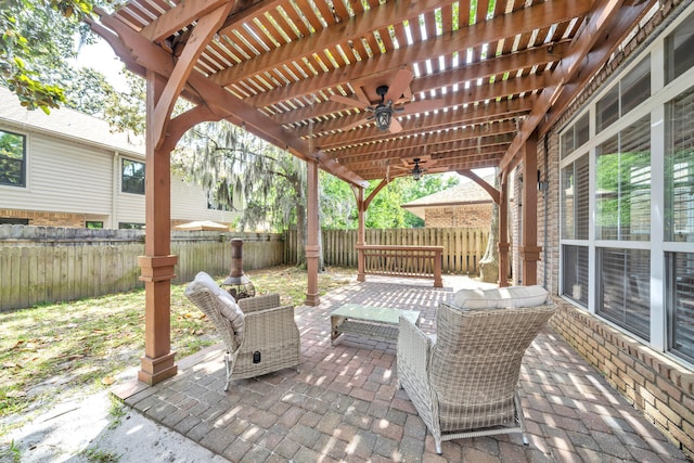 view of terrace with ceiling fan, a pergola, and outdoor lounge area