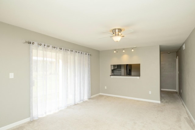 401 Marshall Ct NW Unit 2, Fort Walton Beach, FL 32548 - unfurnished room with a ceiling fan, light colored carpet, and baseboards
