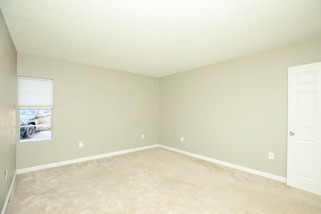 401 Marshall Ct NW Unit 2, Fort Walton Beach, FL 32548 - spare room with light colored carpet and baseboards