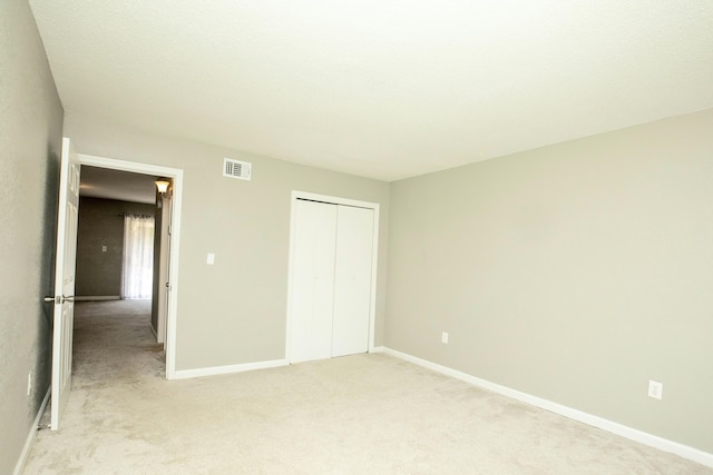401 Marshall Ct NW Unit 2, Fort Walton Beach, FL 32548 - unfurnished bedroom featuring light carpet and baseboards