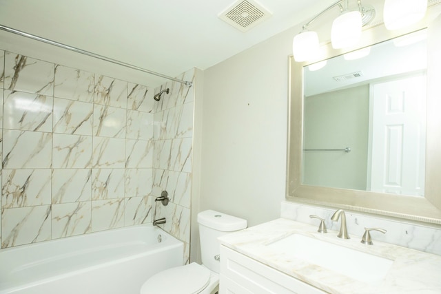 401 Marshall Ct NW Unit 2, Fort Walton Beach, FL 32548 - bathroom featuring vanity, tub / shower combination, and toilet