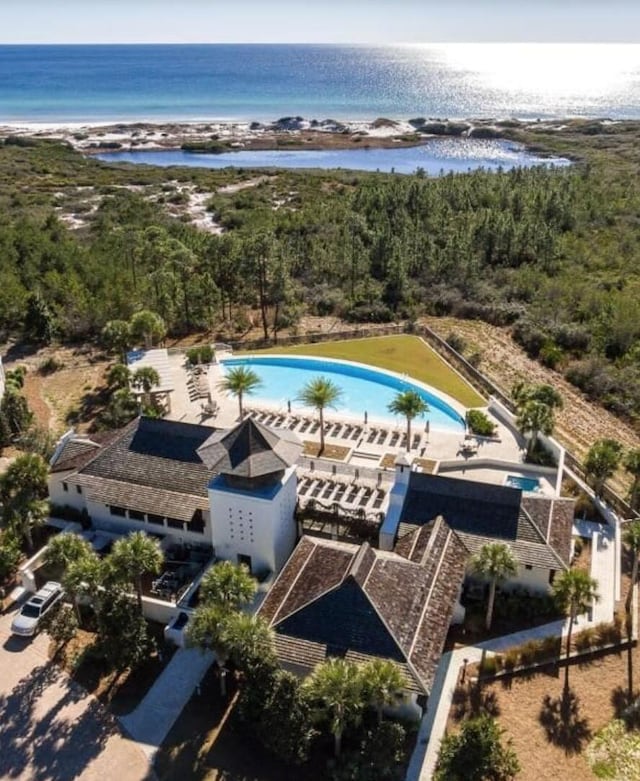 birds eye view of property with a water view