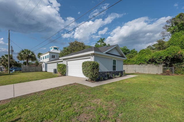 view of side of home with a yard