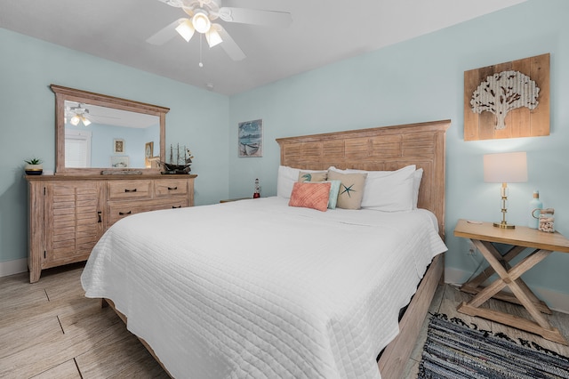 bedroom featuring ceiling fan and light wood-type flooring