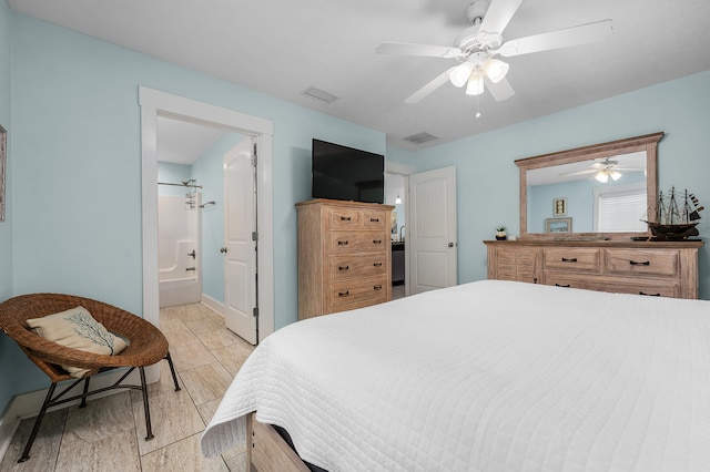 bedroom featuring ceiling fan and ensuite bathroom