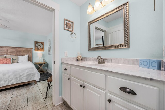 bathroom featuring vanity and tile flooring