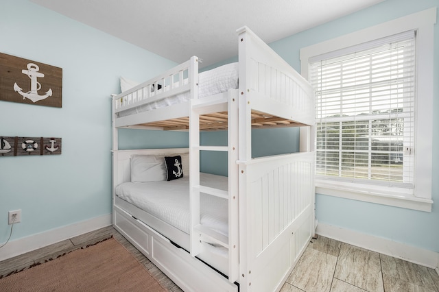 unfurnished bedroom featuring multiple windows