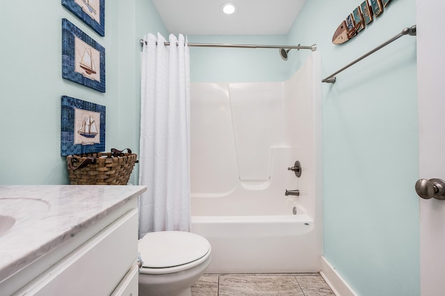 full bathroom featuring tile floors, shower / tub combo, vanity, and toilet