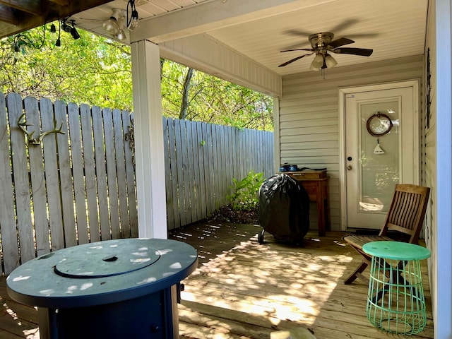 wooden deck with ceiling fan