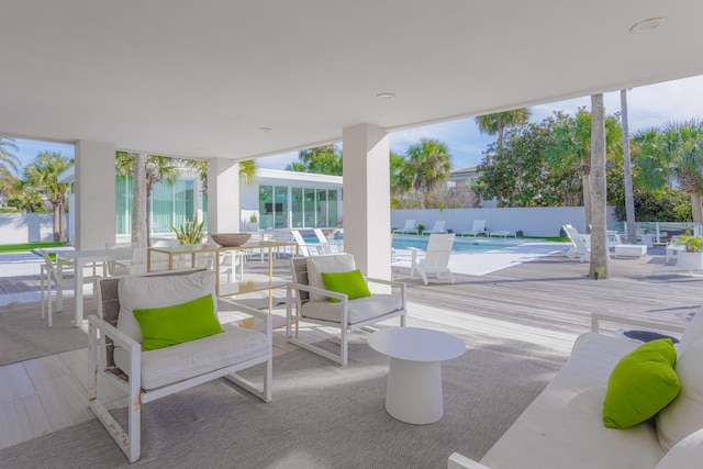 view of patio / terrace with a fenced in pool and fence