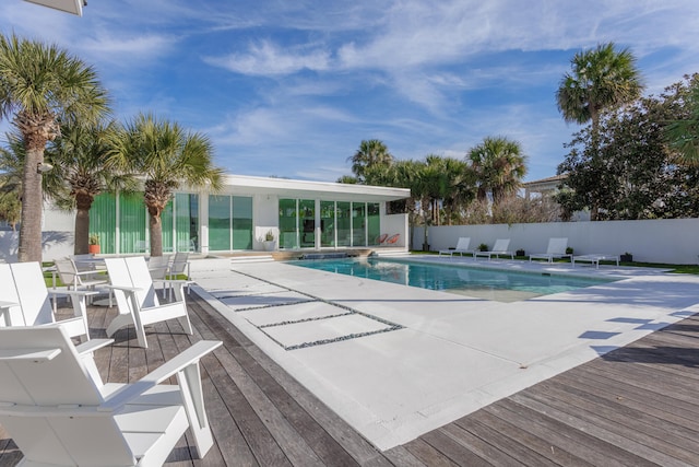 view of pool with a fenced in pool, fence, and a patio