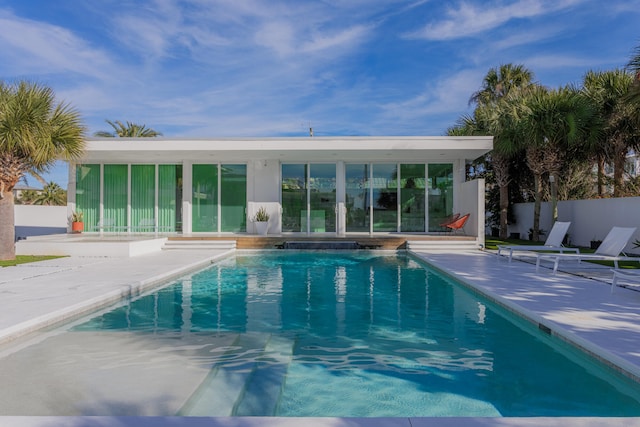 view of swimming pool with a fenced in pool, a patio area, and fence