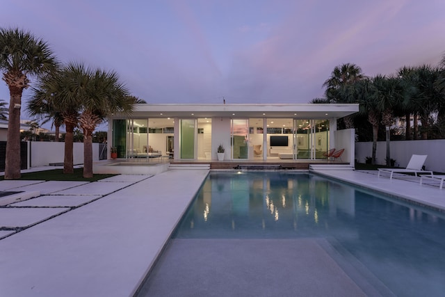 view of pool with a patio area, fence, and a fenced in pool