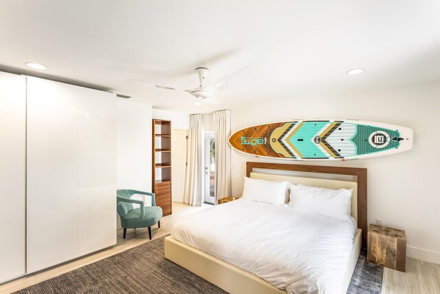 bedroom featuring ceiling fan, wood finished floors, and recessed lighting