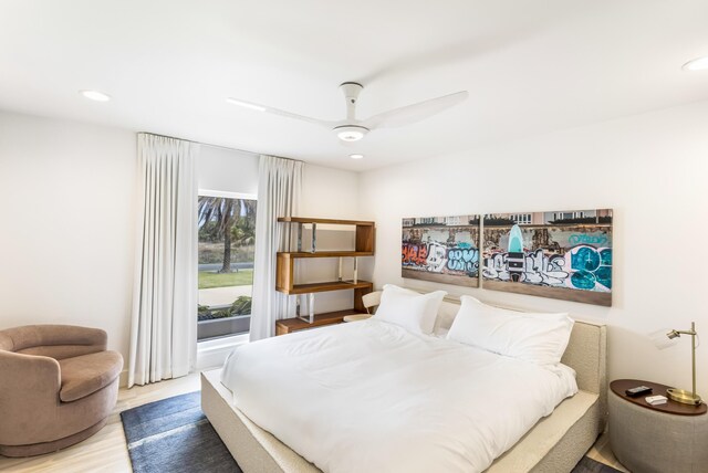 bedroom with recessed lighting, ceiling fan, and wood finished floors